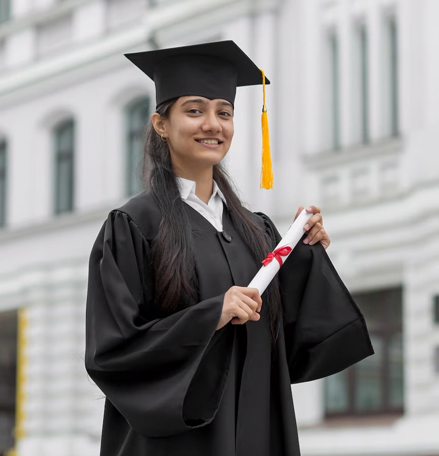 Smiling graduate holding diploma outside university, supported by study abroad agencies in Kerala